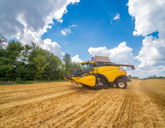 combine-harvester-action-field-combine-harvester-harvesting-machine-harvesting-wheat-field-concept-ceb2474b92cec0ffc1cdd336b612b31e.jpg